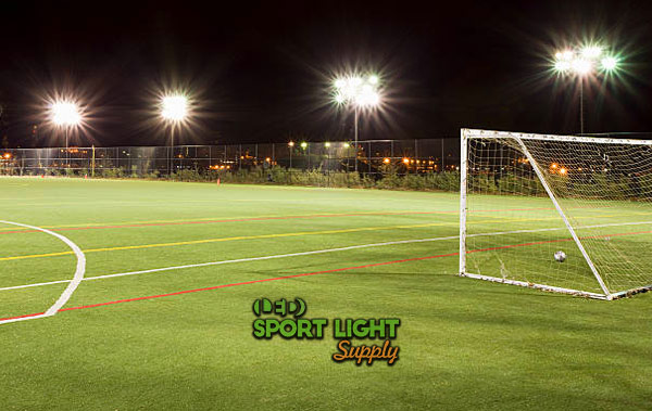 football pitch with floodlights at night